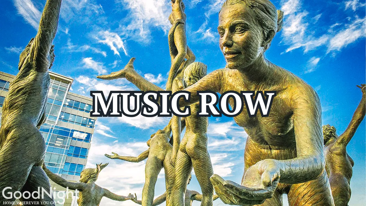 Bronze statues of musical figures and a prominent 'MUSIC ROW' inscription, set in a public space designed for visitors to explore, take photos, and immerse themselves in local music culture. The celebratory mood underscores the area's connection to Nashville’s legendary music scene.